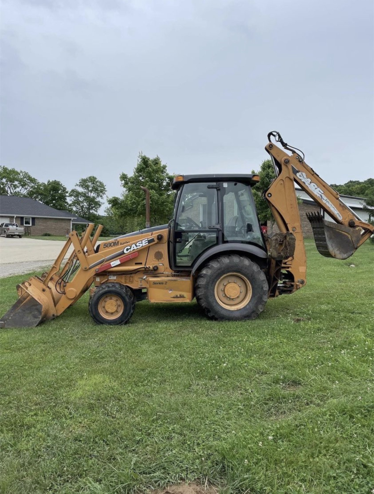 Case backhoe parked outside after the job is done and no longer earning money